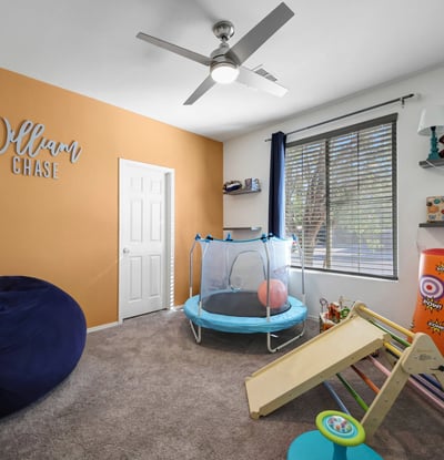 Fourth bedroom with comfortable layout and ceiling fan, easily adaptable to guest use or everyday living.