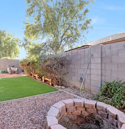 Artificial turf side yard designed for easy care and everyday use, perfect for pets or outdoor activities.
