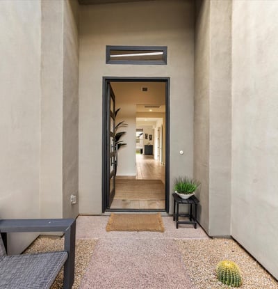 Private courtyard entrance offering a tranquil welcome with modern finishes and desert charm. A stylish introduction to this Scottsdale luxury residence.