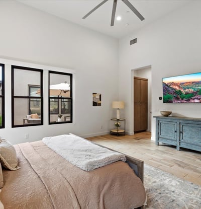Tranquil primary suite with high ceilings and refined finishes, offering a comfortable retreat within this Scottsdale luxury property.
