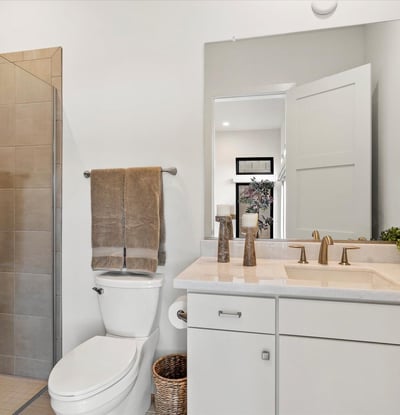 Contemporary casita bathroom with walk-in shower and sleek finishes. Provides hotel-style comfort within this Scottsdale guest suite.