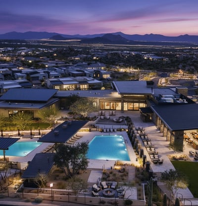 Overhead view of the community pool complex highlighting shaded seating, contemporary architecture, and serene desert surroundings in North Scottsdale.