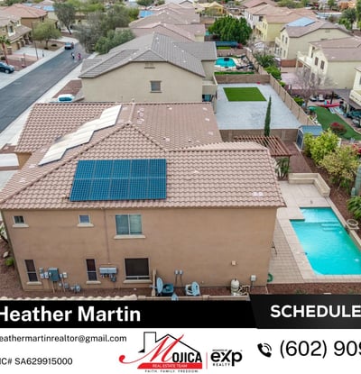Top-down view showcases the extensive solar panel installation for energy efficiency. The tile roof and pool area enhance this Glendale home s overall appeal.