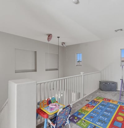 Large loft area overlooking the main entry, offering flexible space for a playroom, lounge, or second living room.