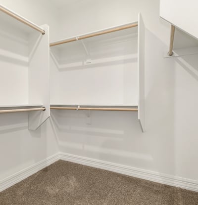 Large walk-in closet with built-in organization, ideal for maximizing storage and keeping everything neatly arranged.