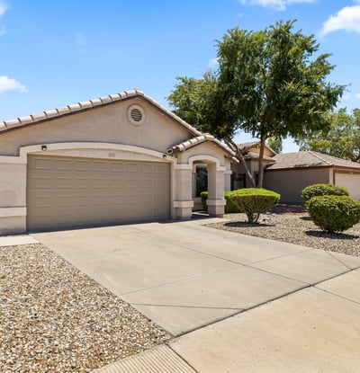 Overhead perspective showcasing the home's lot size, backyard space, and surrounding homes in a well-established Surprise neighborhood.