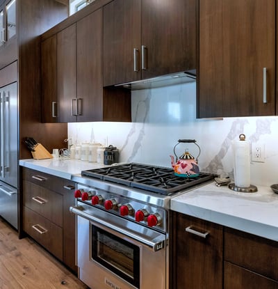 Large island with seating and quartz countertops, creating the perfect gathering space in this open-concept Phoenix home.