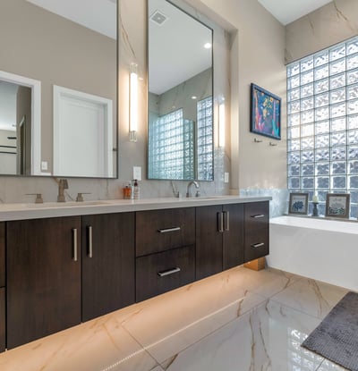 Luxurious bathroom featuring a soaking tub, dual sinks, and modern finishes, creating a relaxing spa-like atmosphere in Phoenix.