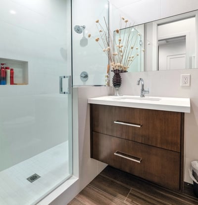 Contemporary bathroom featuring a glass-enclosed shower, modern vanity, and clean design elements in this updated Phoenix residence.