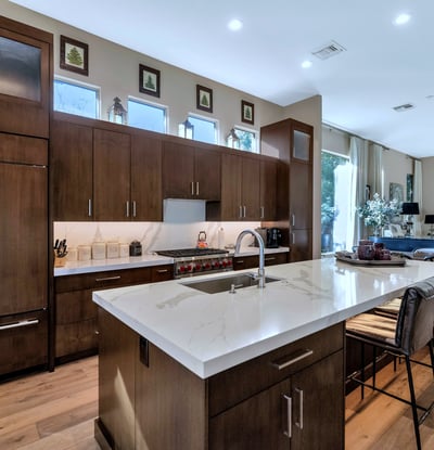 Beautiful kitchen featuring quartz counters, ample cabinetry, and a large island ideal for cooking and entertaining in this Phoenix home.