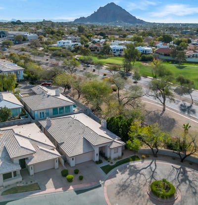Aerial view showcasing a peaceful cul-de-sac with attractive homes, landscaped streets, and convenient access to main roads in Phoenix.