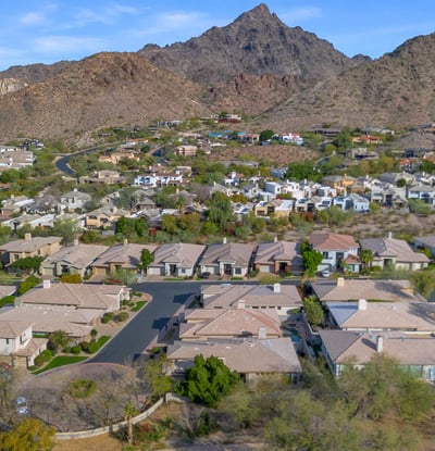 Elevated view of homes nestled in the Phoenix foothills, offering a blend of desert scenery and residential comfort.