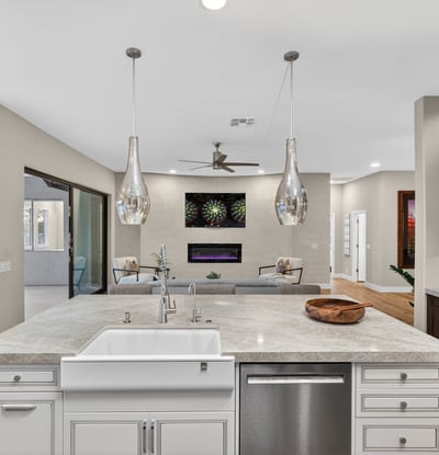 Large island with seating and pendant lighting, perfect for gatherings and daily living in this updated Scottsdale kitchen.