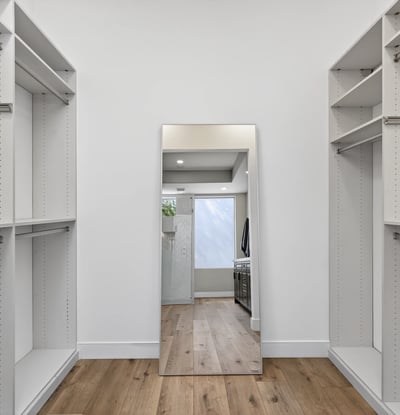 Spacious Scottsdale closet with custom built-ins, shelving, and hanging space designed for organization and storage.