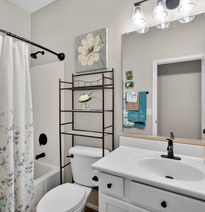 Full bathroom featuring a tub and shower combo with clean finishes. Designed for functionality and ease in Casa Grande.