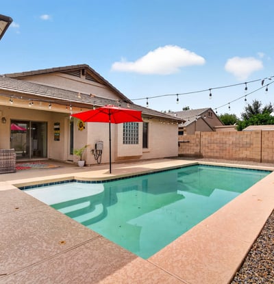 Backyard retreat with pool, patio, and easy-care landscaping. Ideal for relaxing or entertaining in this Casa Grande home.