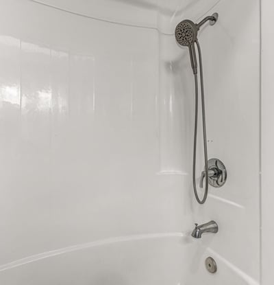 Clean bathroom featuring a tub and shower combo with modern fixtures. This Sun City home includes functional spaces and updated details.