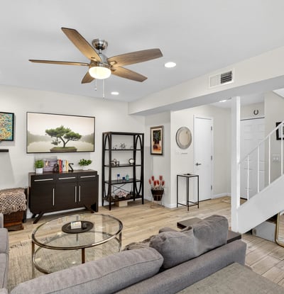 Spacious Scottsdale living room with updated flooring, recessed lighting, and flexible layout ideal for relaxing or hosting guests.