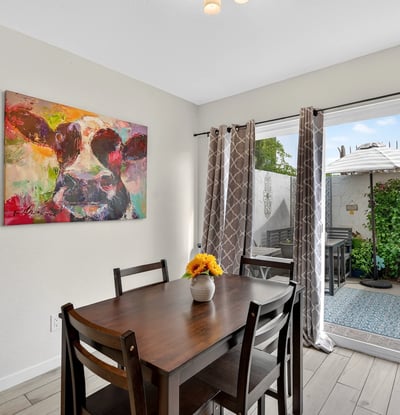 Inviting Scottsdale dining area with sliding glass door to private patio, blending indoor comfort with outdoor living and natural light.