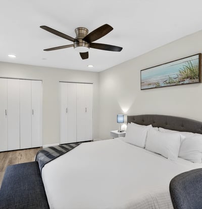 Scottsdale primary bedroom offering dual closets, modern flooring, and a spacious layout designed for comfort and organized living.