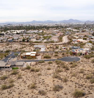 Featured aerial view of this spacious hillside lot showcasing elevated terrain and scenic desert beauty. Perfect for a luxury custom home near South Mountain Preserve and outdoor recreation.