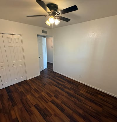 Well-sized bedroom with generous closet storage, ceiling fan, and attractive flooring. Ideal as a guest room, home office, or primary sleeping area within this Glendale apartment home.