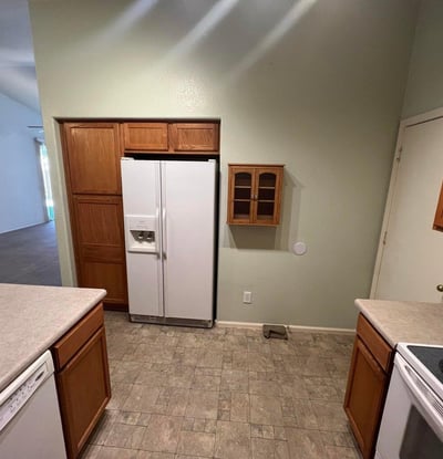 Well-appointed kitchen offering extensive cabinetry, pantry storage, generous counter space, and included appliances. Designed for convenience, this space supports both meal preparation and everyday living.