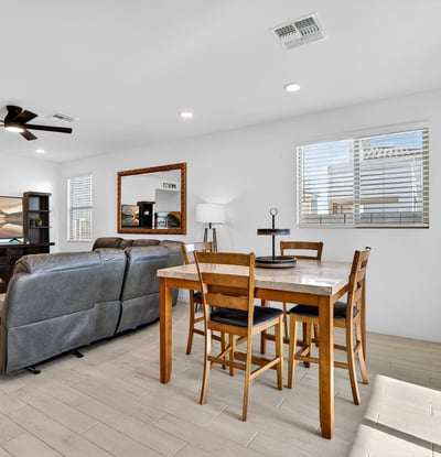 The dining area blends beautifully with the great room, offering an open-concept layout perfect for hosting guests while enjoying natural light and comfortable everyday living.