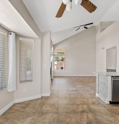 Large windows fill the breakfast nook with natural light while offering views toward the backyard and pool. Conveniently located next to the updated kitchen, this welcoming space is ideal for casual dining.