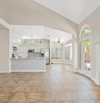 Enjoy an inviting open floor plan where the updated kitchen overlooks the spacious family room with a cozy fireplace and vaulted ceilings. Natural light and backyard access complete this comfortable living space.