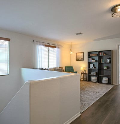 Comfortable loft with updated flooring, entertainment space, and plenty of room for movie nights, gaming, reading, or creating the perfect family retreat.