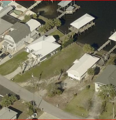 Spacious waterfront property featuring ample outdoor space your own boat dock. Perfect for boating enthusiasts!
