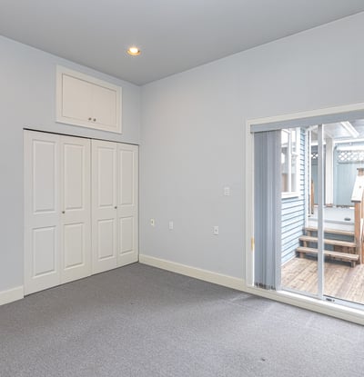 Bright, versatile room with large closet and direct access to a private outdoor space.