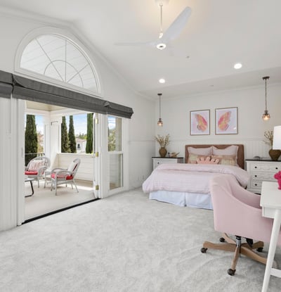 Bedroom 4-Bright and airy bedroom featuring a cozy sitting area, large windows, and modern furnishings with direct access to you own private front balcony.