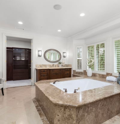 Primary Bathroom -Spacious bathroom featuring a luxurious soaking tub, spacious walk in shower, TV, Toto Neocrest Toilets and a beautifully crafted vanity area. (TV included)