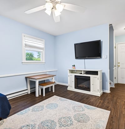 Family room with electric fireplace.