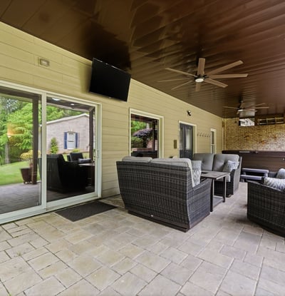 Discover a spacious outdoor patio area perfect for gatherings, complete with comfortable seating and serene views.