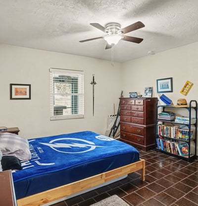 Another view of the first bedroom from the door located off of the hallway across from the bathroom.