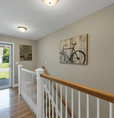 Bright entryway featuring a welcoming atmosphere and modern design, leading to a spacious living area.