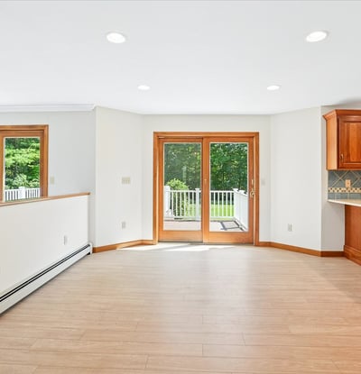 Spacious open-concept living area featuring natural light, premium finishes, and direct access to outdoor space.