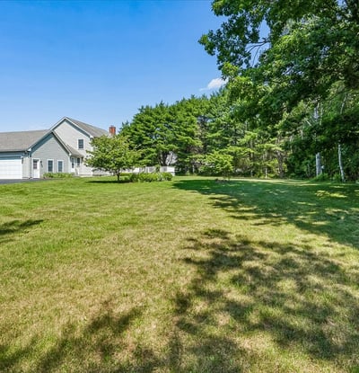 Spacious property featuring a vast lawn, ideal for outdoor activities and future landscaping opportunities.
