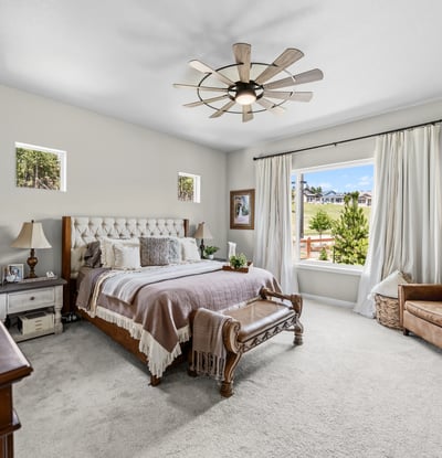 Primary Suite with attached 5 piece bath and walk in closet.