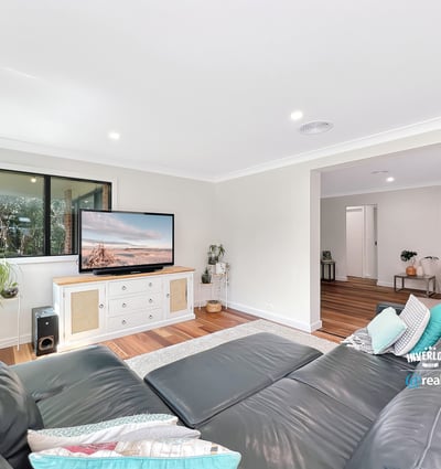 Bright and spacious living area featuring modern furnishings and large windows for natural light.