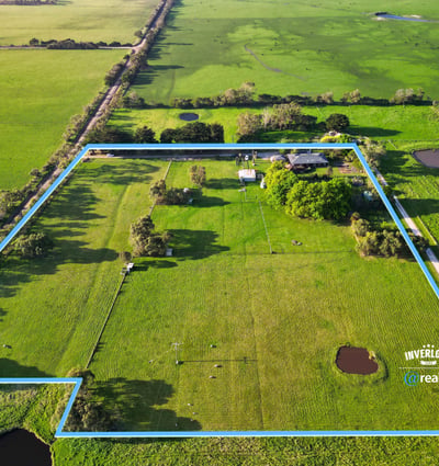 Spacious rural property featuring vast grassy fields, multiple water features, and expansive potential for development.