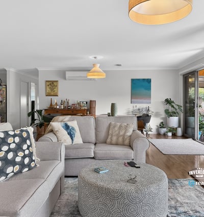 Bright and inviting living area featuring ample natural light, open space, and a seamless outdoor connection.