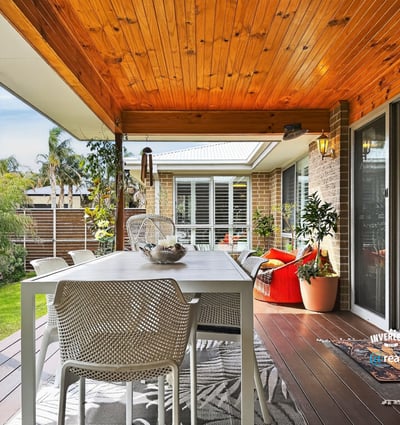 Bright outdoor patio featuring a spacious dining area, perfect for entertaining and enjoying nature.