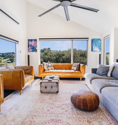 Bright and spacious living area featuring panoramic views, modern furnishings, and ample natural light throughout.