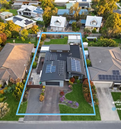 Modern home featuring solar panels and a spacious backyard in a desirable neighborhood. Conveniently located near amenities.
