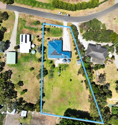 Spacious property featuring a modern home, expansive yard, and ample potential in a peaceful neighborhood.