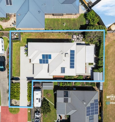 Spacious property featuring modern architecture, ample yard space, and energy-efficient solar panels, perfect for families.